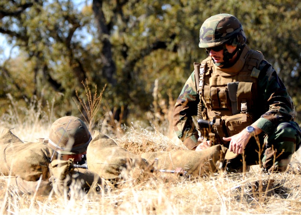 US Navy 081209-N-9584N-039 Lt. Michael Tomsik gives Builder Constructionman Nicholas Boltin pointers to improve his fighting position
