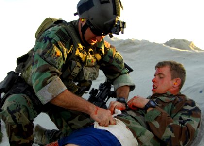 US Navy 081210-N-5366K-073 A Special Warfare Combatant-craft Crewman treats an injured teammate during a casualty assistance and evacuation scenario