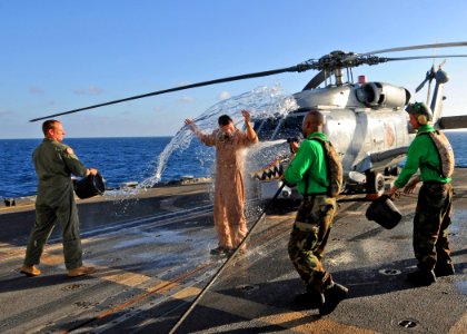 US Navy 081217-N-1082Z-049 Lt. Scott Miller is cooled off by Sailors aboard USS Vella Gulf (CG 72)