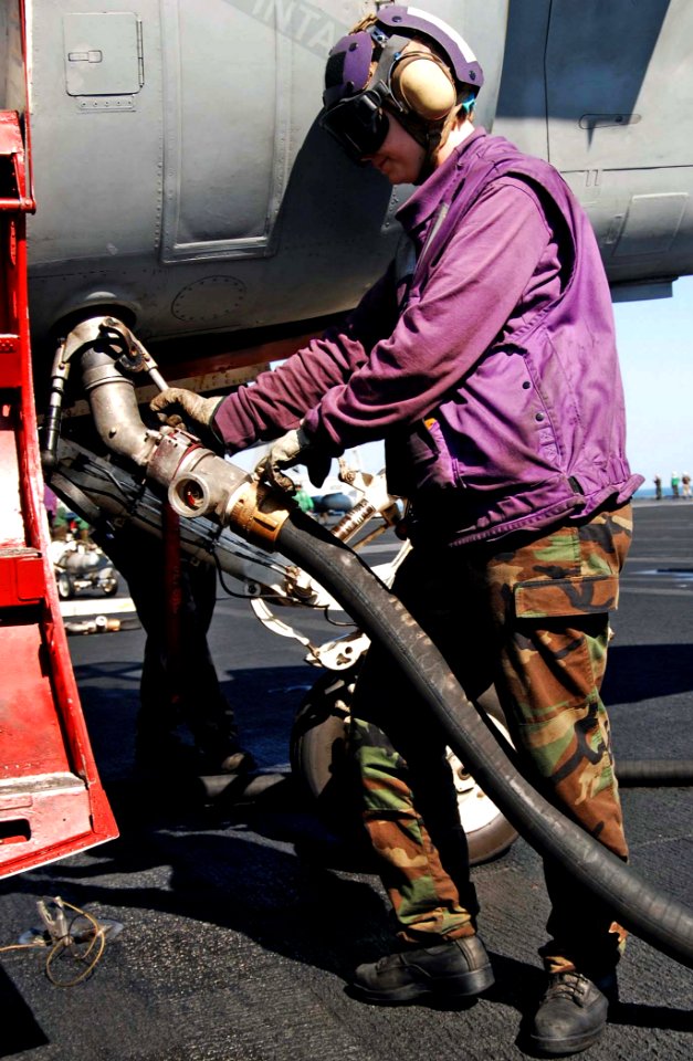 US Navy 081208-N-8822R-036 Aviation Boatswain's Mate (Fuels) Airman Jessica Cook re-fuels an EA-6B Prowler assigned to the