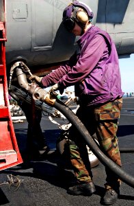 US Navy 081208-N-8822R-036 Aviation Boatswain's Mate (Fuels) Airman Jessica Cook re-fuels an EA-6B Prowler assigned to the