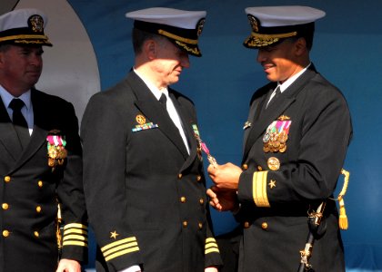 US Navy 081212-N-7668G-026 Cmdr. John Kropcho III is presented the Legion of Merit by Rear Adm. Bruce Grooms during a change of command ceremony aboard the Los Angeles-class attack submarine USS Jacksonville (SSN 699) at Naval