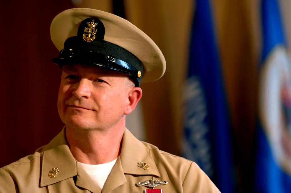 US Navy 081212-N-9818V-253 Incoming Master Chief Petty Officer of the Navy (MCPON) Rick D. West listens as retiring MCPON Joe R. Campa, Jr. delivers remarks during the Passing of the Cutlass and retirement ceremony