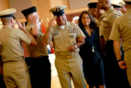 US Navy 081212-N-9818V-462 Master Chief Petty Officer of the Navy (MCPON) Joe R. Campa, Jr. and his wife Diana Campa pass through the sideboys after the Passing of the Cutlass and retirement ceremony photo