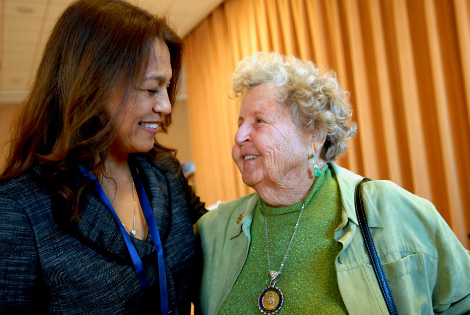 US Navy 081212-N-9818V-479 Diana Campa, wife of Master Chief Petty Officer of the Navy (MCPON) Joe R. Campa, Jr., speaks with Ima Black, widow of the Navy's first MCPON, after a Passing of the Cutlass and retirement ceremony at