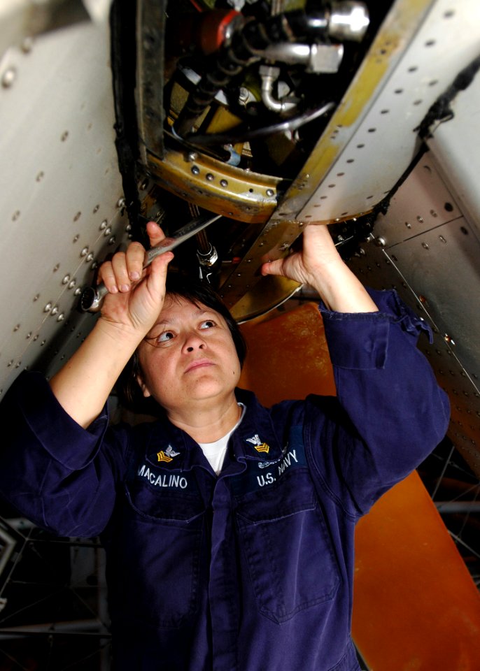 US Navy 081210-N-5681S-010 Gas Turbine System Technician (Mechanical) 1st Class Marie Macalino, assigned to Assault Craft Unit (ACU) 4, performs maintenance to a landing craft air cushion (LCAC) aboard the multi-purpose amphibi