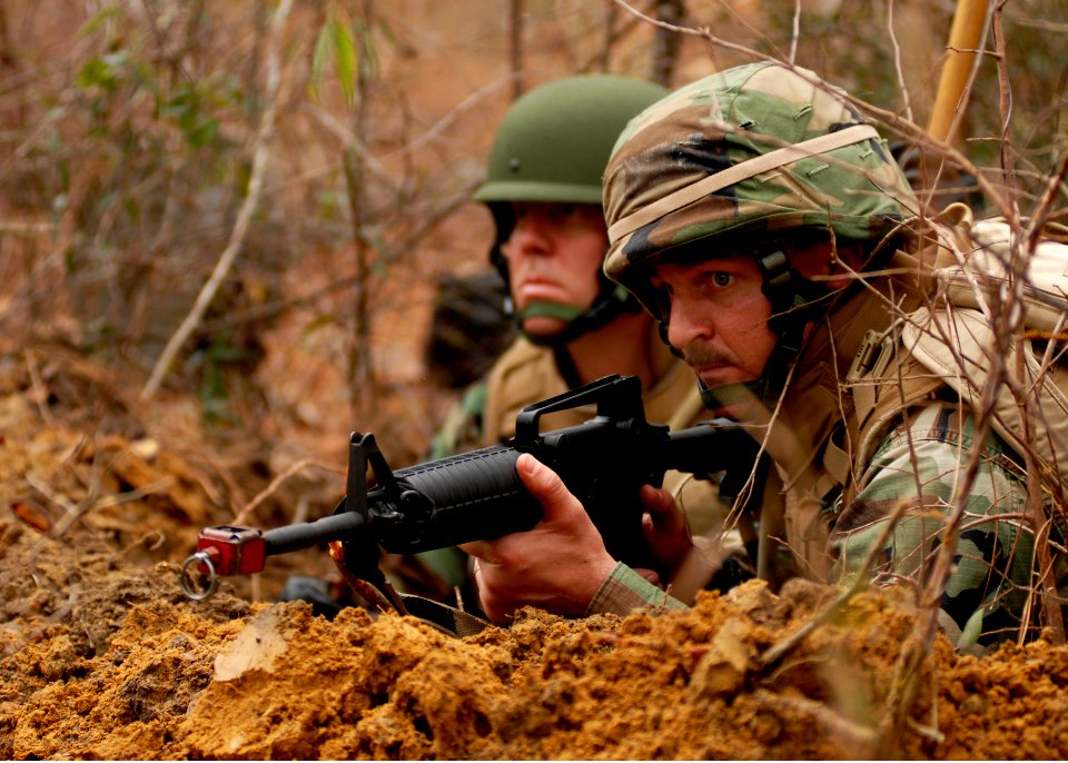 US Navy 081215-N-3674H-194 Construcion Mechanic Senior Chief Matthew Aninos keeps watch in a fighting position at Camp Shelby