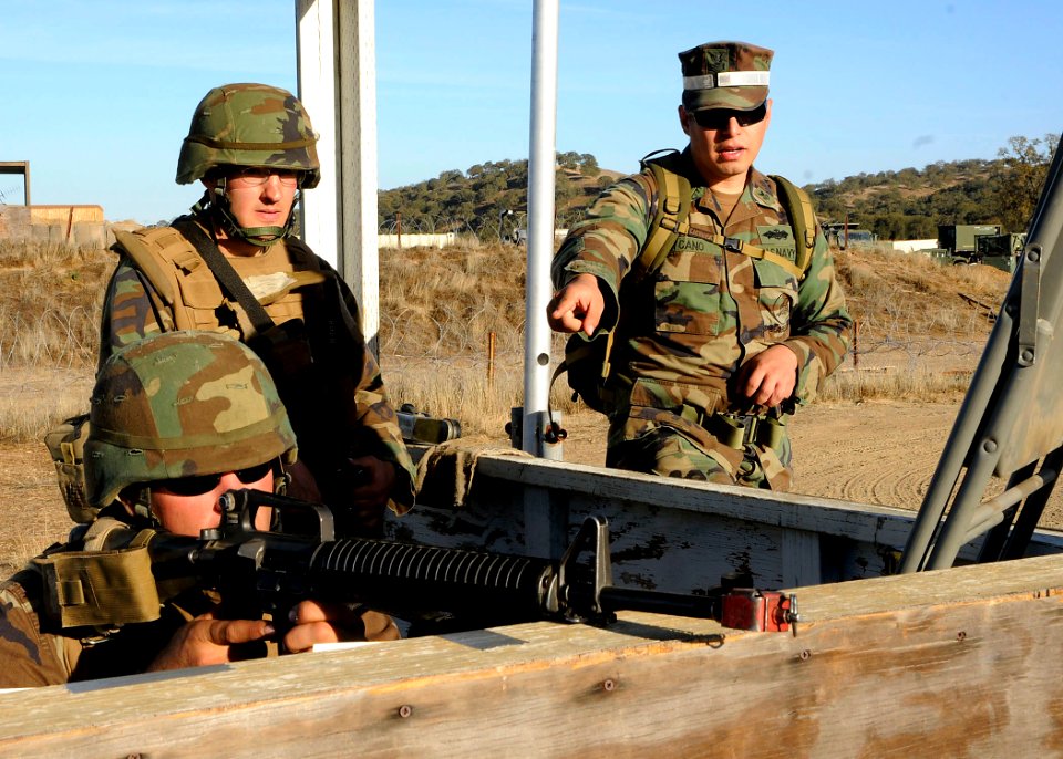 US Navy 081210-N-9584N-160 Steel Worker 1st Class Angel Cano, right, advises Construction Mechanic Constructionman William Brushwood and Construction Mechanic 2nd Class Nicholas Oreh during the Naval Mobile Construction Battali