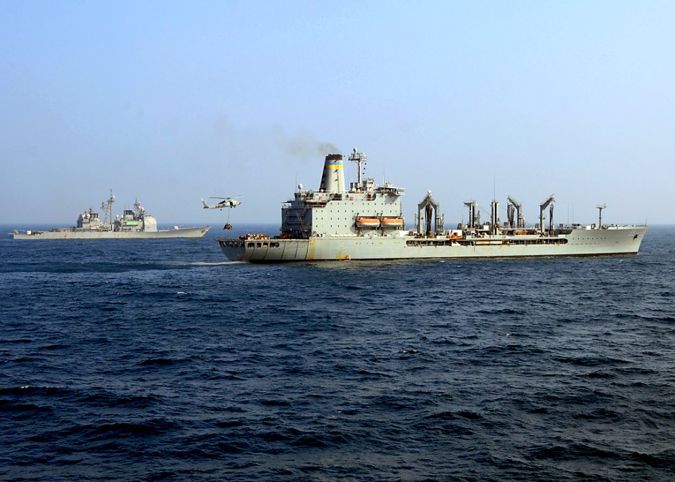 US Navy 081227-N-1082Z-066 An SH-60B Sea Hawk conducts a vertical replenishment with Military Sealift Command fleet replenishment oiler USNS Tippecanoe (T-AO 199)