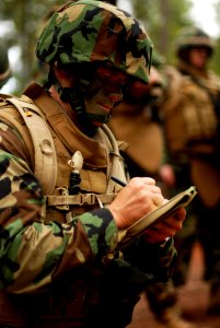 US Navy 081217-N-3674H-022 Ensign Dennis Lang writes out instruction for a patrol during a training exercise
