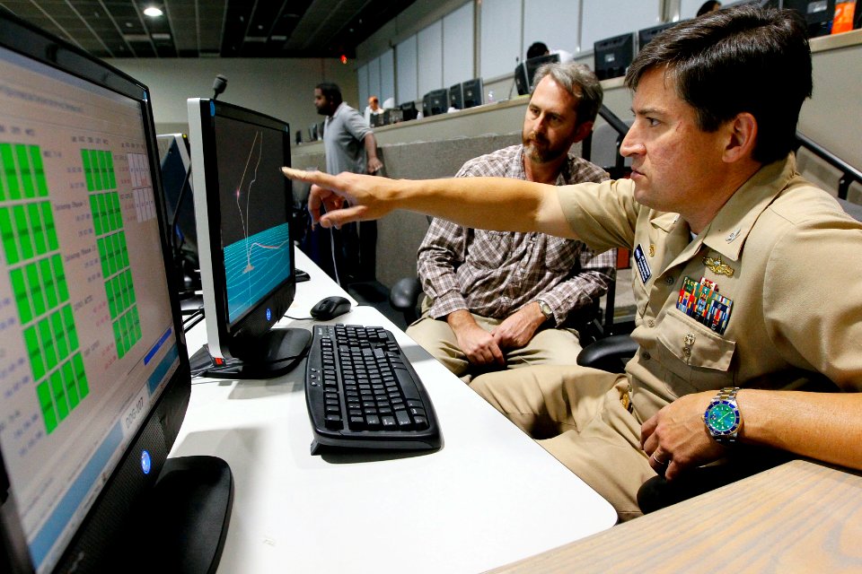 US Navy 110315-N-HW977-160 Capt. Jay Kadowaki, right, commanding officer of Naval Surface Warfare Center (NSWC), Corona Division, and Flight Analy