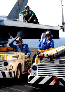 US Navy 081217-N-7571S-008 Flight deck personnel observe flight operations aboard USS Theodore Roosevelt (CVN 71)