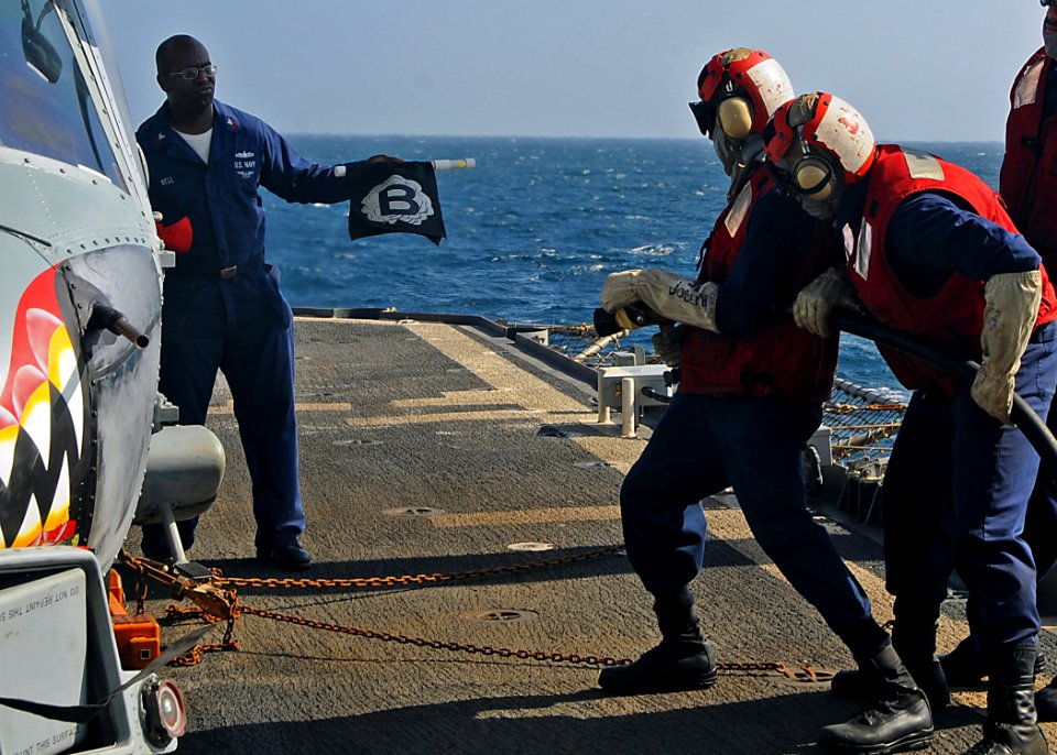 US Navy 081231-N-1082Z-043 Sailors practice firefighting techniques during a flight deck fire drill