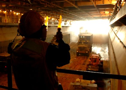 US Navy 081228-N-4236E-116 Boatswain's Mate Seaman Cornelius Gibbs directs a landing craft air cushion photo