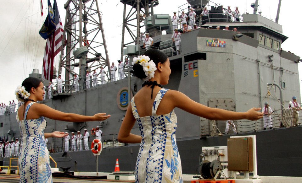 US Navy 081219-N-0879R-001 Hula dancers perform as family and friends welcome USS Reuben James (FFG 57) during the ship's return to Naval Station Pearl Harbor