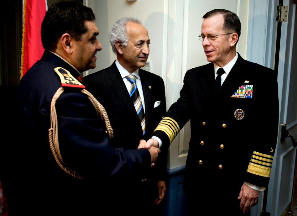 US Navy 090106-N-0696M-026 Adm. Mike Mullen is greeted by Staff Brig. Gen. Ismael H. Alsodani and Samir Al Sumaida'ie at the celebration marking the 88th anniversary of the creation of the Iraqi armed forces