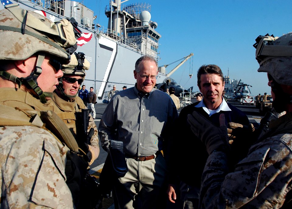 US Navy 081219-N-5681S-066 U.S. Reps. Mike Conaway, left, and Rob Whitman speak with Marines on the flight deck of the multi-purpose amphibious assault ship USS Iwo Jima (LHD 7)