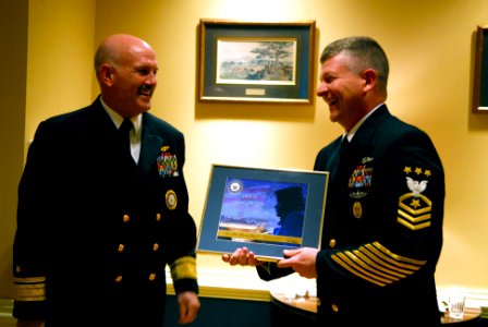 US Navy 090106-N-9818V-034 Master Chief Petty Officer of the Navy (MCPON) Rick D. West receives a framed photograph from Rear Adm. Joseph F. Kilkenny, Commander, Navy Recruiting Command