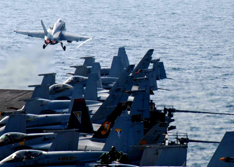 US Navy 081217-N-9900B-006 An F-A-18 Hornet launches from the flight deck of the aircraft carrier USS Theodore Roosevelt (CVN 71)