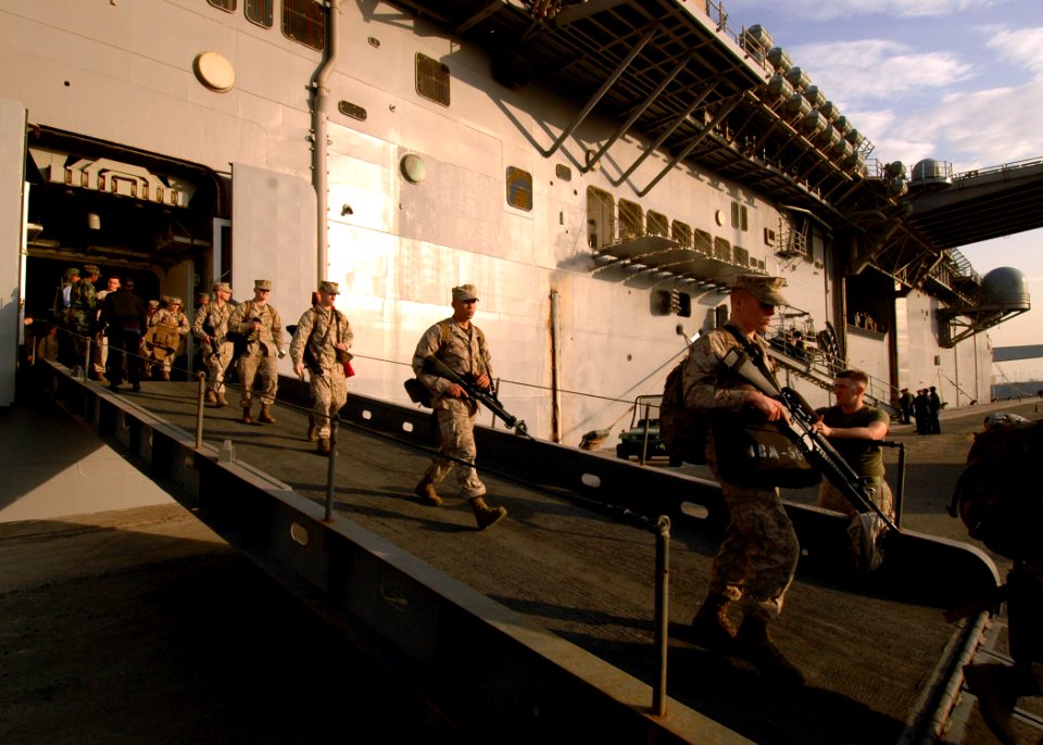 US Navy 081229-N-4236E-005 Marines depart the multi-purpose amphibious assault ship USS Iwo Jima (LHD 7)