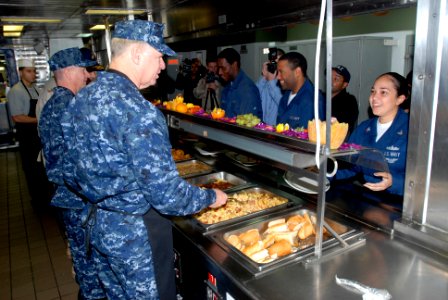 US Navy 081219-N-0803S-006 Chief of Naval Operations (CNO) Gary Roughead, right, and Master Chief Petty Officer of the Navy (MCPON) Rick West serve lunch to Sailors and Marines