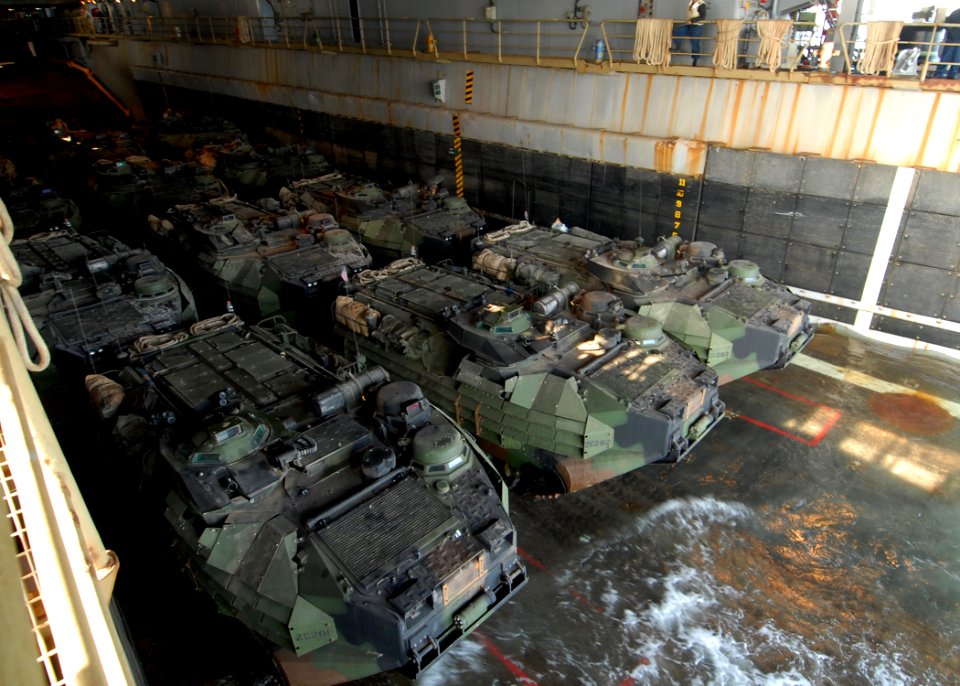 US Navy 081229-N-9134V-036 Amphibious assault vehicles prepare to disembark from the well deck of the amphibious dock landing ship USS Carter Hall (LSD 50)