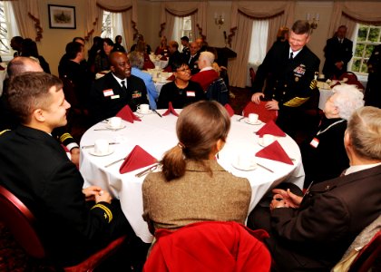 US Navy 090107-N-7948R-003 aster Chief Petty Officer of the Navy (MCPON) Rick D. West chats with Recruiters of the Year (ROY) and their family members during an awards ceremony at the Capitol Hill Club