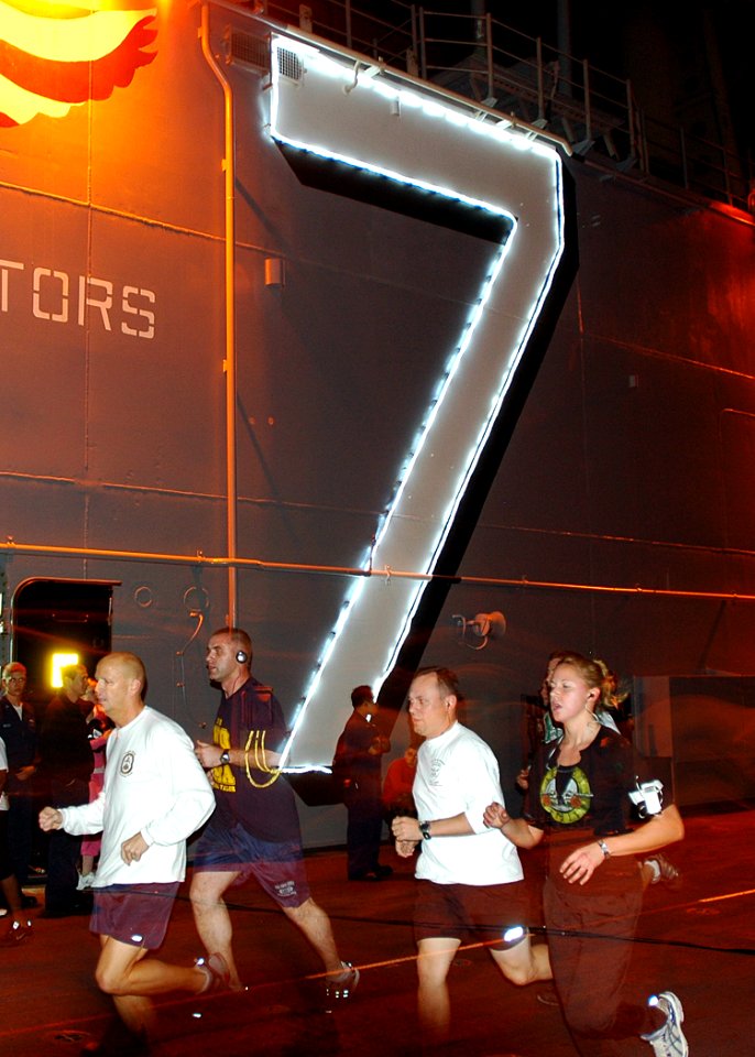 US Navy 090101-N-5681S-054 Sailors participate in a New Years Day 5k run on the flight deck of the multi-purpose amphibious assault ship USS Iwo Jima (LHD 7)