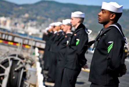 US Navy 110414-N-UA460-069 Aviation Boatswain's Mate (Handling) Airman Chris Pierce mans the rails as the amphibious assault ship USS Essex (LHD 2)