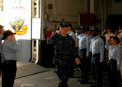 US Navy 081219-N-4236E-011 Chief of Naval Operations (CNO) Adm. Gary Roughead walks through side boys during his visit to USS Iwo Jima (LHD 7)