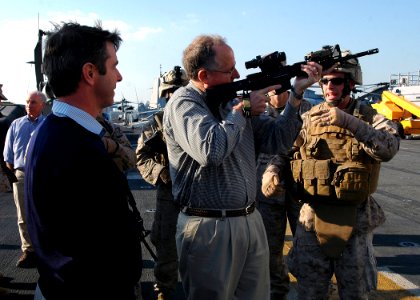 US Navy 081219-N-5681S-074 Marines demonstrate weapons to U.S. Reps. Rob Whitman, left, and Mike Conaway aboard the multi-purpose amphibious assault ship USS Iwo Jima (LHD 7)