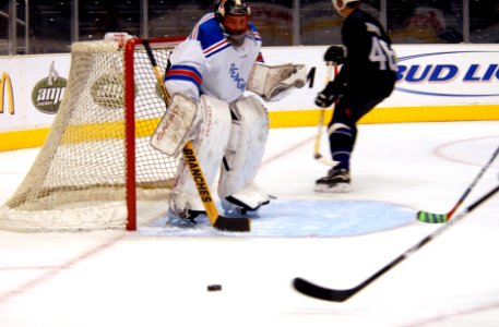 US Navy 090108-N-4005H-106 Command Master Chief Mark Rudes tries to block a shot during an exhibition match with the Los Angeles Kings Alumni at the Staples Center
