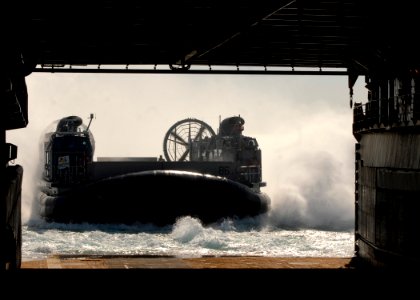 US Navy 090106-N-3392P-011 A landing craft air cushion enters the well deck of the amphibious dock landing ship USS Carter Hall (LSD 50) photo