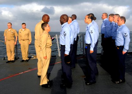 US Navy 081224-N-1082Z-005 Command Master Chief Susan A. Whitman, of Piety Hill, Ill., conducts a personnel inspection aboard the guided-missile cruiser USS Vella Gulf (CG 72)