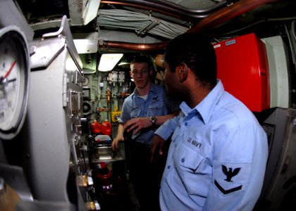 US Navy 090106-N-7705S-006 achinist's Mate 3rd Class Joseph Christians onducts training with Electronics Technician 3rd Class Marcus Hoggard