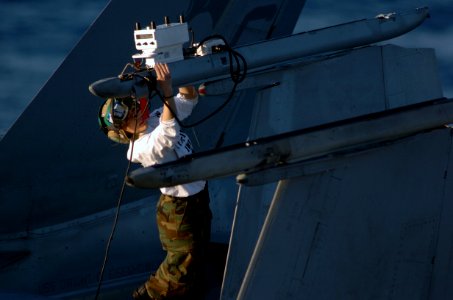 US Navy 090110-N-0933M-018 Aviation Electronics Technician 2nd Class Kimberly Clark performs a weapons system release and control check on an F-A-18C Hornet