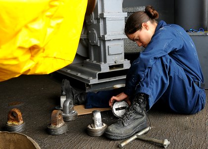US Navy 110507-N-2908M-013 Boatswain's Mate Seaman Sheri Muniz wire brushes underway replenishment equipment aboard USS Kearsarge (LHD 3)