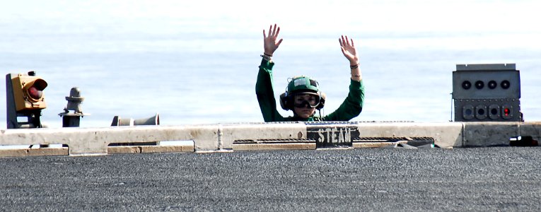 US Navy 081229-N-8822R-028 viation Boatswain's Mate (Equipment) 3rd Class Nancy Germann stands by as catapult steam operator to launch aircraft from the aircraft carrier USS Theodore Roosevelt (CVN 71)