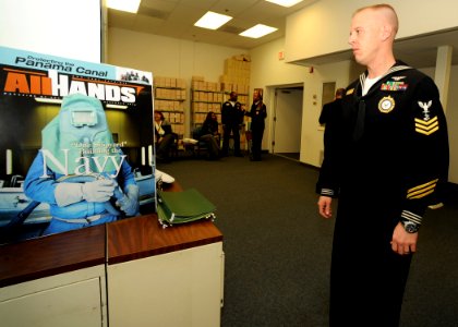 US Navy 090105-N-7948R-002 Navy Career Counselor 1st Class Josh Vinson akes a tour of Defense Media Activity Anacostia