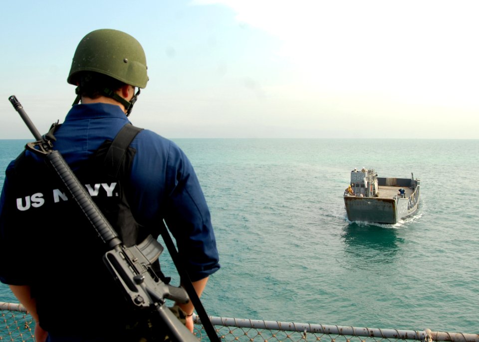 US Navy 081229-N-9134V-105 Seaman Keith Kelleher observes a landing craft utility