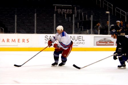 US Navy 090108-N-4005H-164 A member of the Los Angeles Kings Alumni skates during an exhibition match with the Ronald Reagan's hockey team