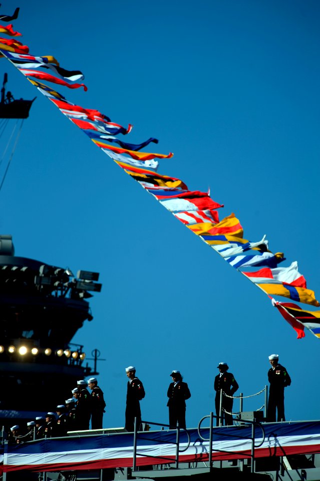 US Navy 090110-N-0696M-143 Sailors man the rails and bring the ship to life at the commissioning ceremony for the aircraft carrier USS George H.W. Bush (CVN 77)