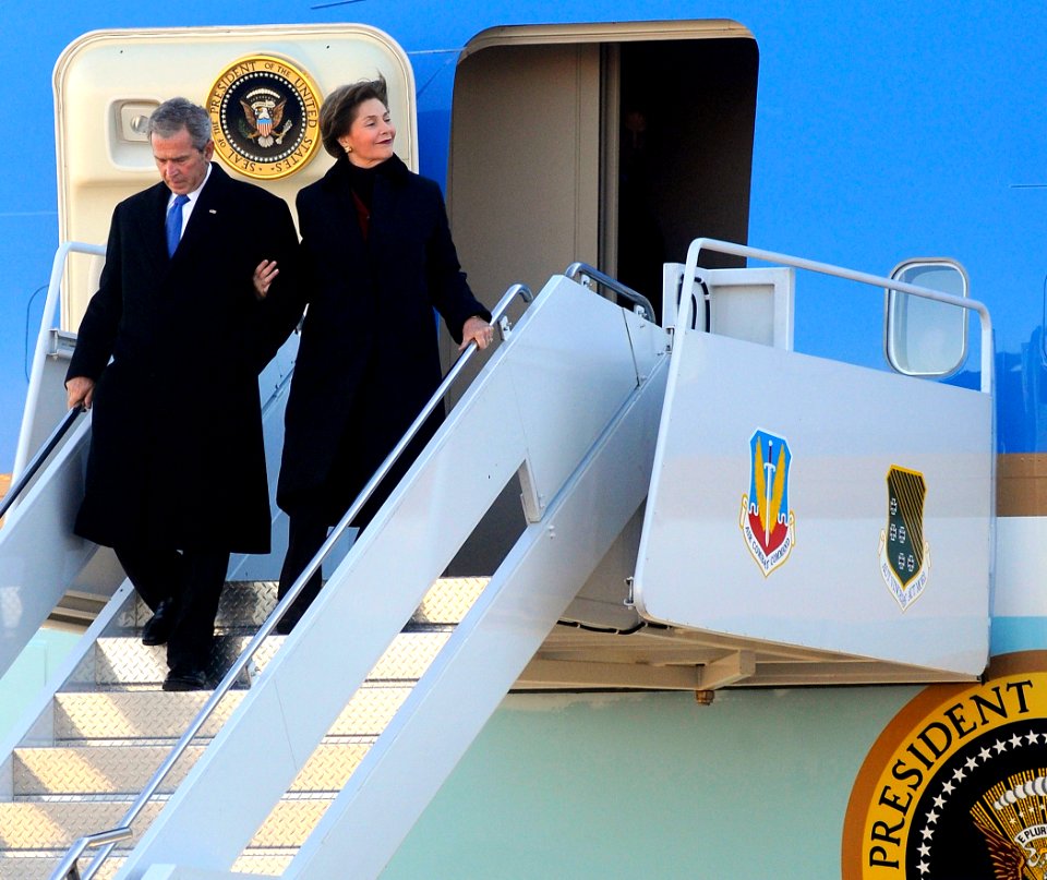 US Navy 090110-N-5345W-059 President George W. Bush and his wife, first lady Laura Bush, disembark from Air Force One
