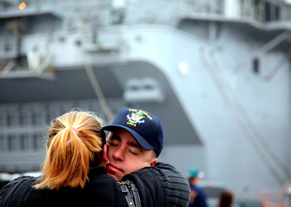 US Navy 090109-N-9150R-070 A sailor assigned to the amphibious assault ship USS Boxer (LHD 4) says goodbye to a loved one on the pier before to the ship's departure from San Diego