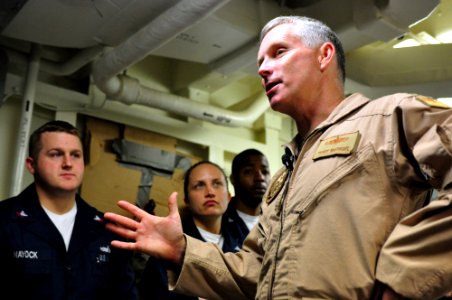 US Navy 090115-N-9693M-002 Rear Adm. Terry McKnight conducts an Admiral's call with members of Fleet Surgical Team 8 aboard USS San Antonio (LPD 17) photo