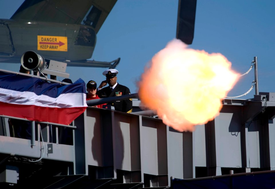 US Navy 090110-N-0696M-054 Sailors fire the saluting battery in honor of President George W. Bush at the commissioning ceremony for the aircraft carrier USS George H.W. Bush (CVN 77)