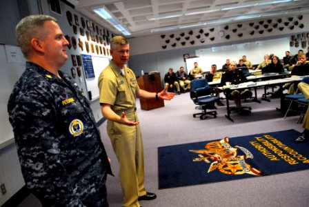 US Navy 090114-N-9818V-322 Command Master Chief Bill Peterson, of Naval War College, wears the Navy working uniform as Master Chief Petty Officer of the Navy (MCPON) Rick D. West speaks with the Prospective Commanding Officer,