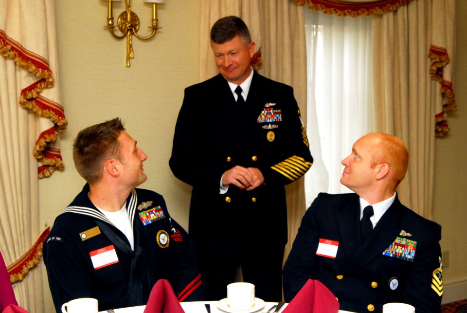 US Navy 090107-N-9818V-019 Master Chief Petty Officer of the Navy (MCPON) Rick D. West talks with Construction Electrician 2nd Class Justin Urban and Mass Communication Specialist Senior Chief Tom Jones during the Recruiters of