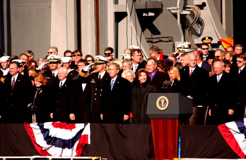 US Navy 090110-N-6125G-062 Capt. Kevin E. O'Flaherty, commanding officer of the aircraft carrier USS George H.W. Bush (CVN 77) salutes during the national anthem with President George W. Bush