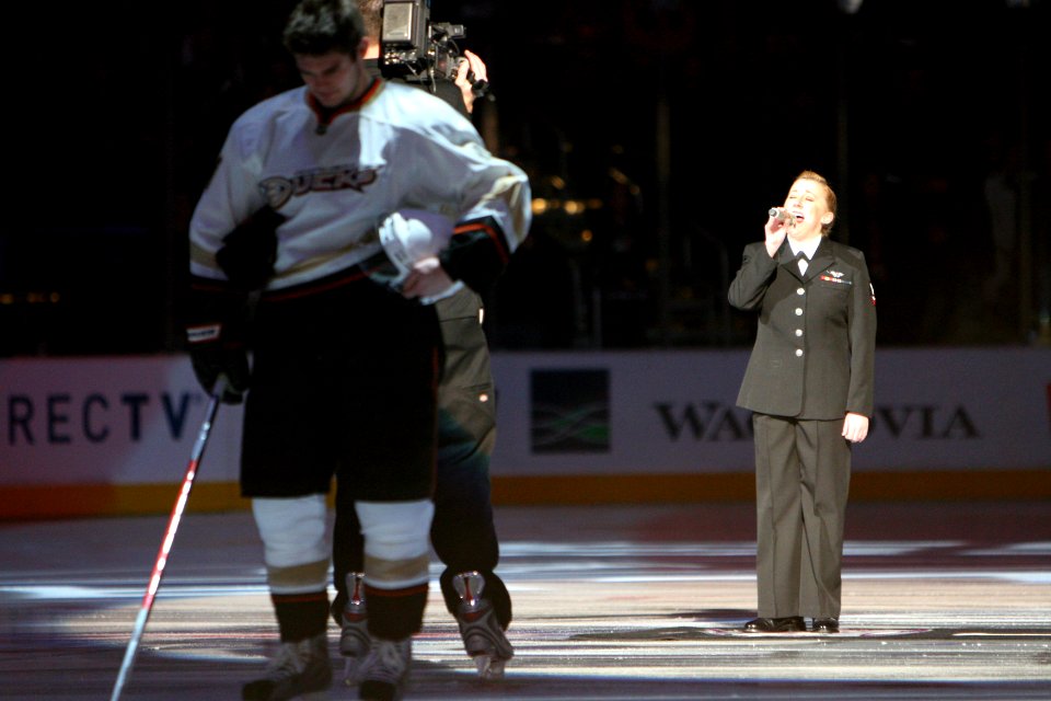 US Navy 090108-N-3659B-592 Aviation Ordnanceman 3rd Class Elise Clover sings the national anthem at the Staples Center